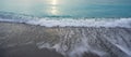 Florida ocean shore with advancing waves at sunrise