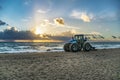 Florida sunrise beach sand comber tractor Royalty Free Stock Photo