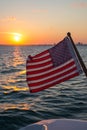 American Flag on Stern of Yacht Sailing Offshore, Sunset