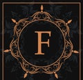 Florishes gold letter F calligraphic heraldic dark background Royalty Free Stock Photo