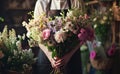 a florist in an apron with several bouquets and flowers Royalty Free Stock Photo