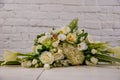 The florist creates a floral arrangement of roses, lilacs, callas, carnations, hydrangeas, brasica, alstroemeria, ornithogalum, Royalty Free Stock Photo