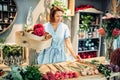 Florist decorates composition with birch bark