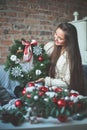 Florist Girl with Christmas Decorations Glass Balls