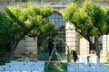 Florist girl decorates wedding arch with fresh flowers. Wedding florist decorators workflow Royalty Free Stock Photo