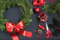 Florist hands making Christmas wreath