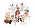 Florist making bouquet in flower shop. Woman at work in retail store with modern plants, sitting at table. Small