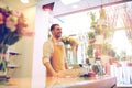 Florist man or seller at flower shop counter Royalty Free Stock Photo