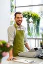 Florist man or seller at flower shop counter Royalty Free Stock Photo