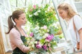 Florist presenting bouquet to customer