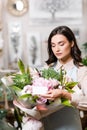 Florist putting empty tag on festive