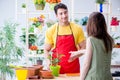 The florist selling flowers in a flower shop Royalty Free Stock Photo