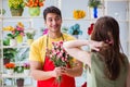 The florist selling flowers in a flower shop Royalty Free Stock Photo