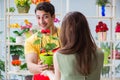 The florist selling flowers in a flower shop Royalty Free Stock Photo