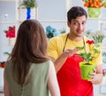 Florist selling flowers in a flower shop Royalty Free Stock Photo