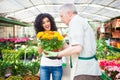 Florist selling flowers to a customer Royalty Free Stock Photo