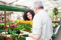 Florist selling flowers to a customer Royalty Free Stock Photo