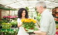 Florist selling flowers to a customer Royalty Free Stock Photo