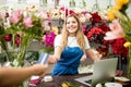 Florist taking a credit card payment Royalty Free Stock Photo