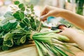 Florist ties a ribbon on a bouquet of flowers Royalty Free Stock Photo