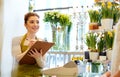 Florist woman and man making order at flower shop Royalty Free Stock Photo