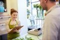 Florist woman and man making order at flower shop Royalty Free Stock Photo