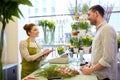 Florist woman and man making order at flower shop Royalty Free Stock Photo