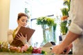 Florist woman and man making order at flower shop Royalty Free Stock Photo