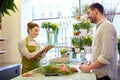 Florist woman and man making order at flower shop Royalty Free Stock Photo