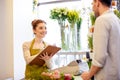 Florist woman and man making order at flower shop Royalty Free Stock Photo