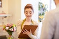 Florist woman and man making order at flower shop Royalty Free Stock Photo