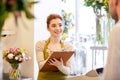 Florist woman and man making order at flower shop Royalty Free Stock Photo