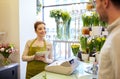 Florist woman and man making order at flower shop Royalty Free Stock Photo