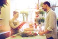 Florist woman and man making order at flower shop Royalty Free Stock Photo