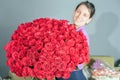 Florist woman prepares a big bouquet of red roses Royalty Free Stock Photo