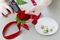 Florist at work: How to make hair decoration made of roses and fern Royalty Free Stock Photo