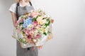 Florist at work. Make Serenity hydrangea rich bouquet. flowers in their hands Royalty Free Stock Photo