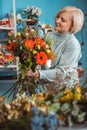 Florist in the workplace. Flower shop. Portrait of a smiling woman Royalty Free Stock Photo