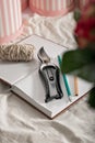 Florist workplace. Small business concept. Diary for order records, pencils, flower scissors. Flowers and accessories. Vertical Royalty Free Stock Photo