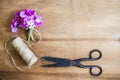 Floristic background. Flowers, old scissors and a jute. Royalty Free Stock Photo