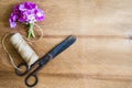 Floristic background. Flowers, old scissors and a rope. Royalty Free Stock Photo