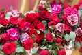 Floristic composition of gorgeous red peony roses, carnations and eucalyptus twigs