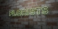 FLORISTS - Glowing Neon Sign on stonework wall - 3D rendered royalty free stock illustration