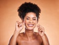 Floss, portrait and teeth of black woman in studio with product for dentist, dental and mouth cleaning healthcare Royalty Free Stock Photo