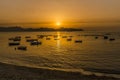 A flotilla of small boats moored at Aspra Sicily at sunset Royalty Free Stock Photo