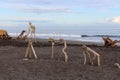Flotsam wooden sculpture on the Tasman Sea beach of Hokitika in South Island New Zealand