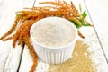 Flour amaranth in white bowl on board