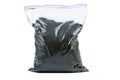 Flour of black caraway in plastic bag isolated on a white