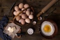 flour, broken chicken eggs, butter and stuffing on a wooden table Royalty Free Stock Photo