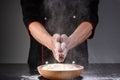 flour and chef in a black tunic1 Royalty Free Stock Photo
